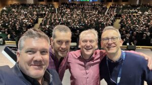 Me. Kevin Monahan, Bill Ayers, and Paolo Pialorsi on the main stage at ESPC25